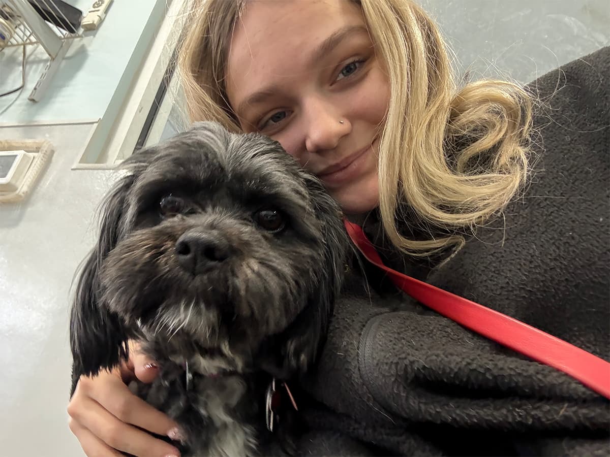 Leader of the Pack team member with a dog