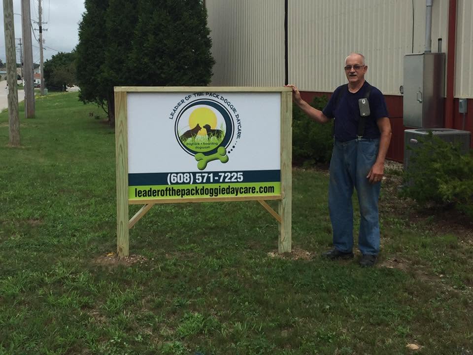 Al standing next to the hand-built Leader of the Pack road sign